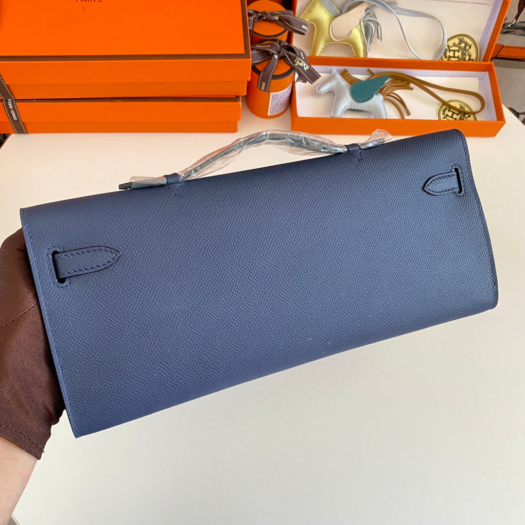 HERMES KELLY CUT 31 IN CLASSIC BLUE CALFSKIN WITH GOLD HARDWARE