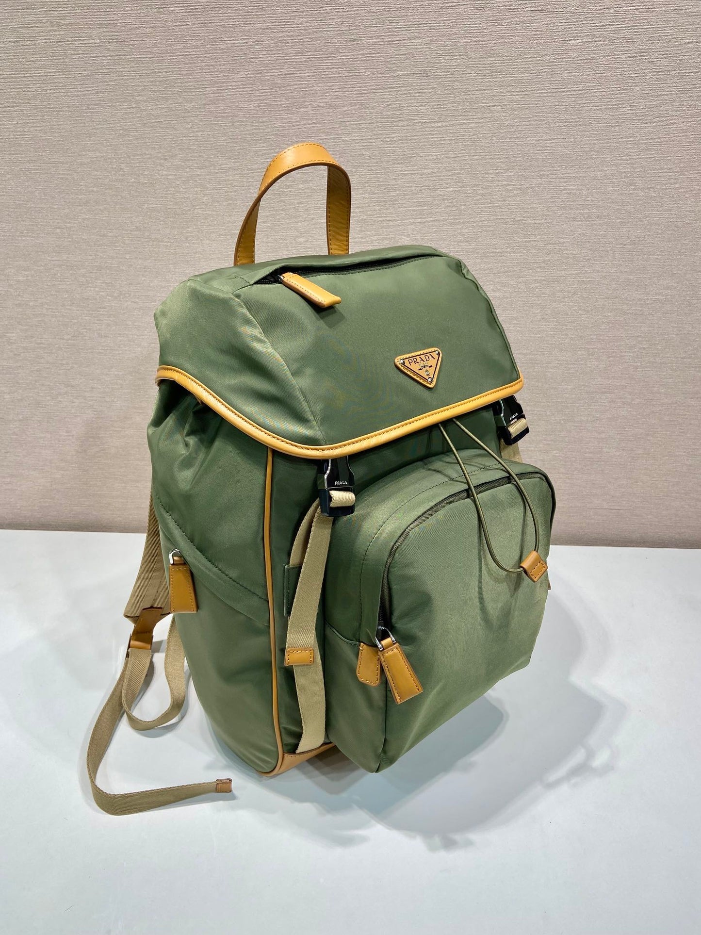 PRADA BACKPACK 45 IN SEAWEED GREEN RE-NYLON AND BROWN CALFSKIN TRIM
