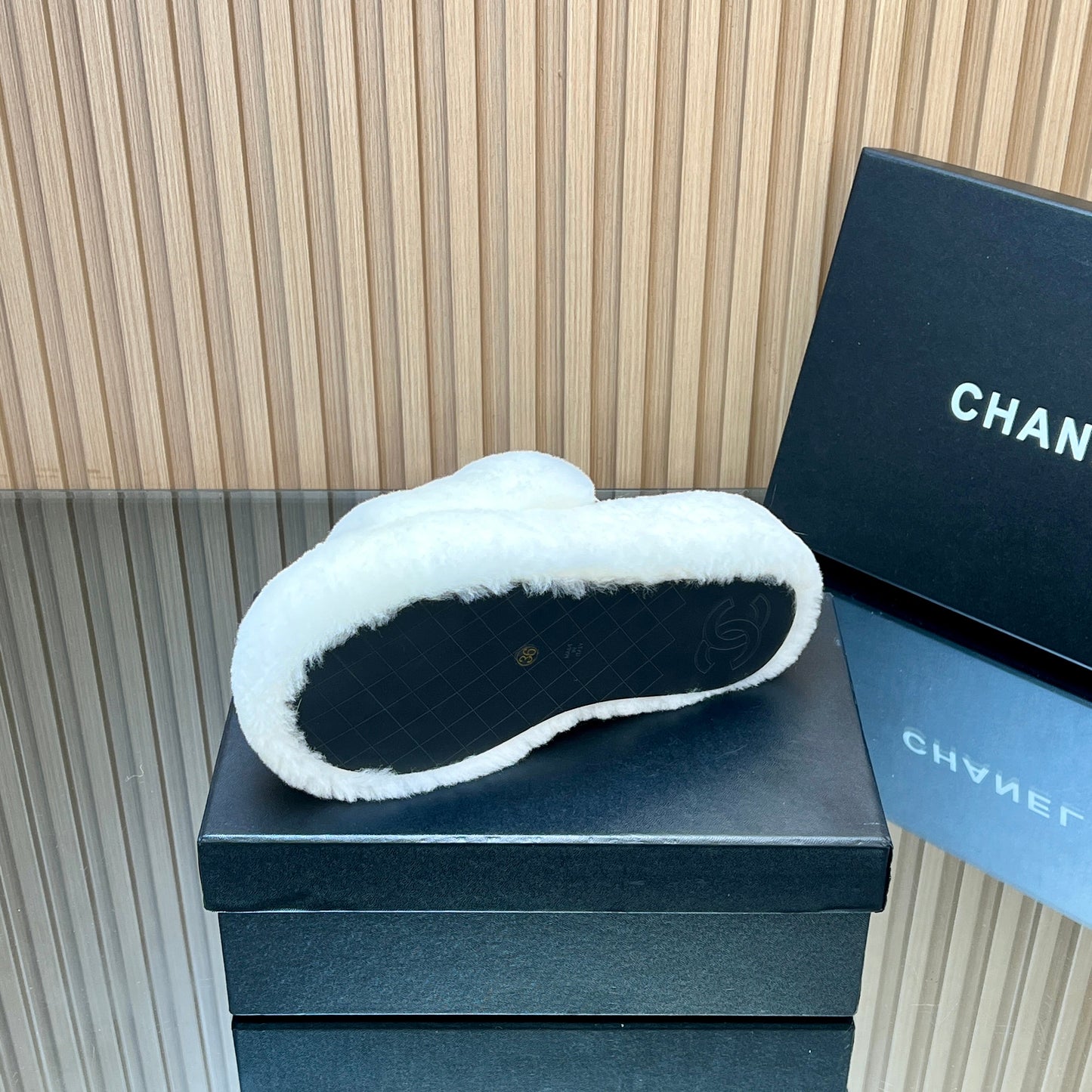 CHANEL 25S THICK-SOLED FURRY SLIPPERS WITH ELASTIC STRAPS IN WHITE FUR